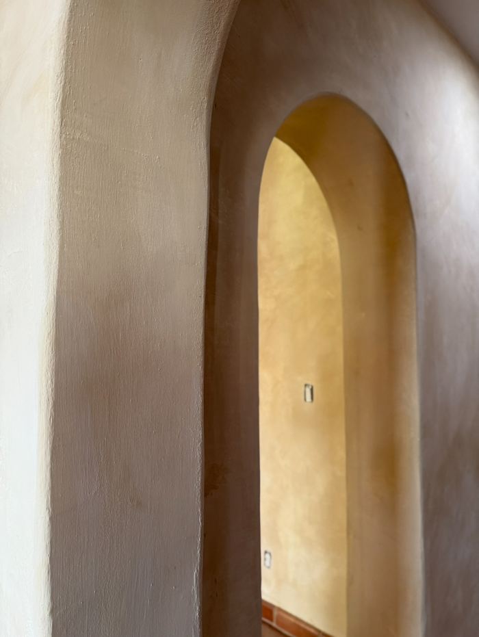 Arched lime plaster doorway detail
