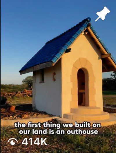 Reel: the first thing we built on our land is an outhouse, with blue tile roof