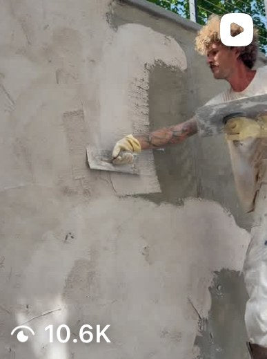 Reel: troweling a lime plaster scratch coat onto an exterior wall
