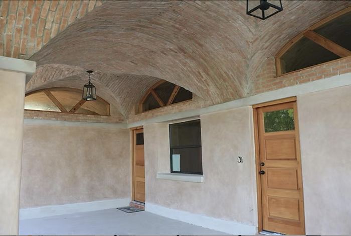Brick groin vault ceiling with wood doors