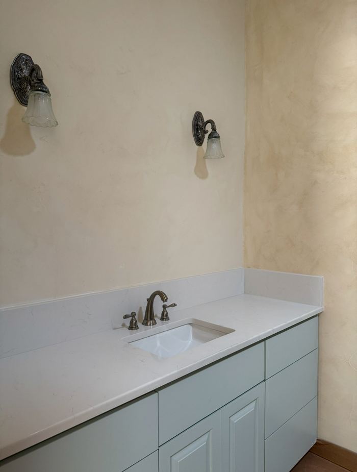 Lime plaster bathroom wall with vanity