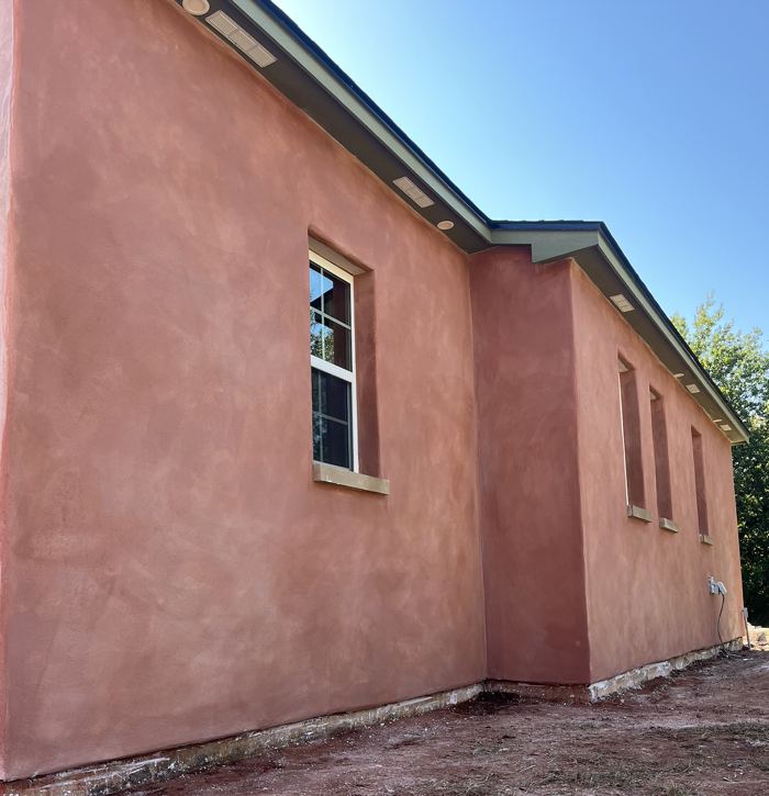 Terracotta lime plaster exterior, angled view