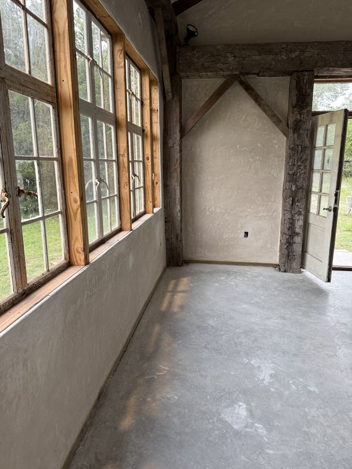 Timber-frame interior with antique windows