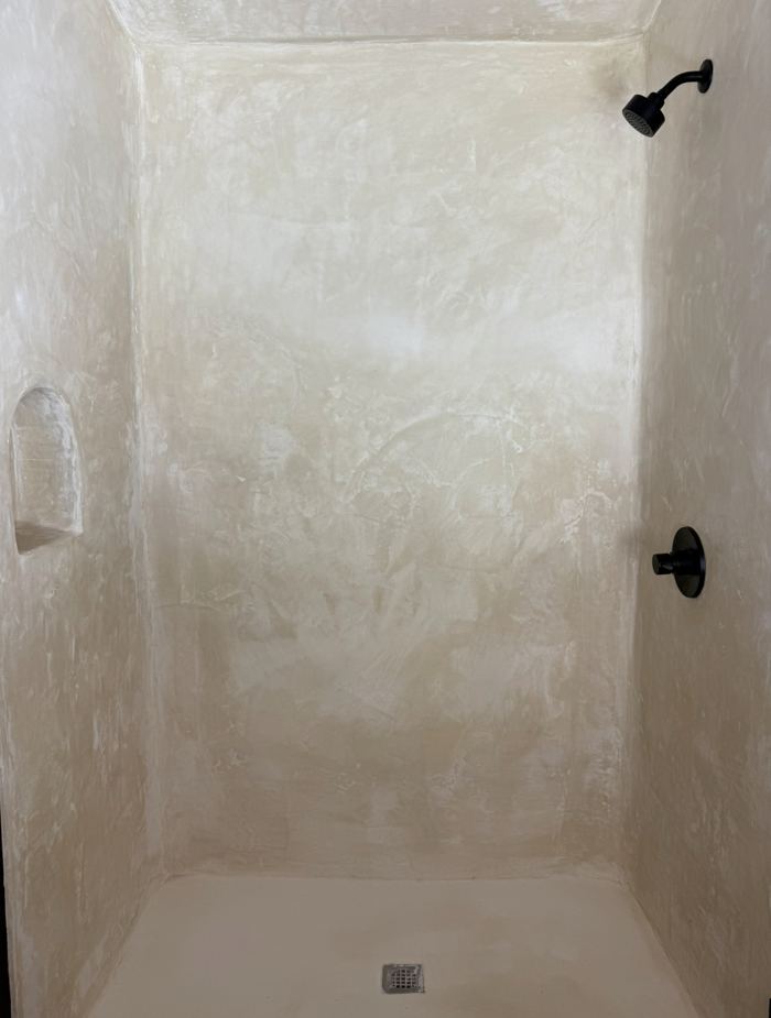 Cream tadelakt shower with matte black fixtures